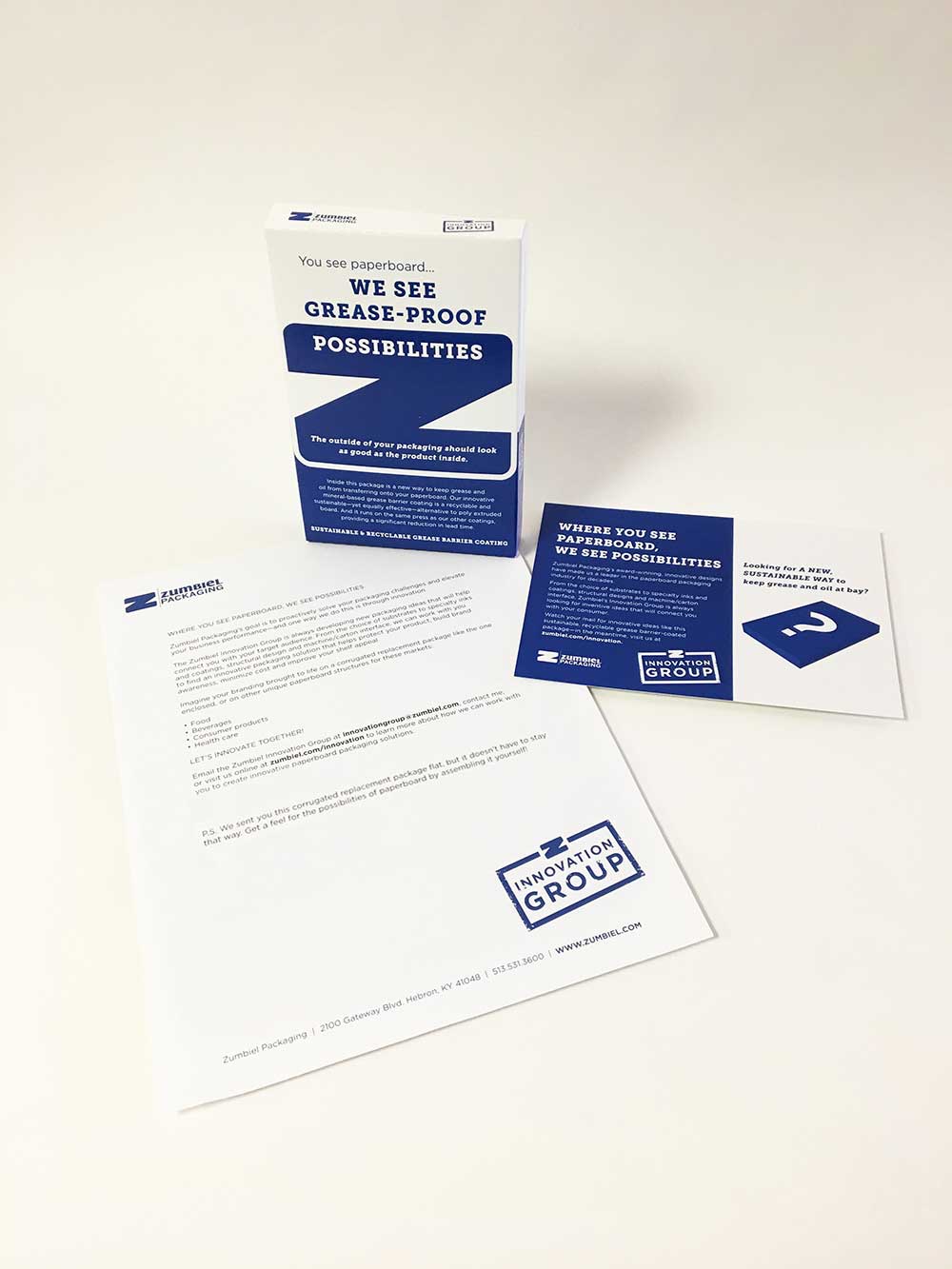 Direct mail campaign with grease-proof box